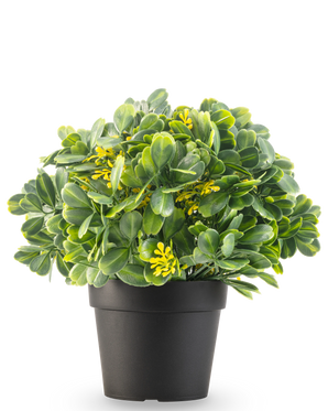 The Artificial Plant Green/yellow UV 21 cm has green leaves and small yellow flowers in a plain black pot, against a white background.