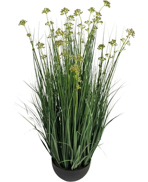 The Artificial Grass Leek Flower Onion Grass Pot 100cm fire retardant has long, slender green grass-like leaves and small yellow-green flower clusters in a round black pot, against a white background.