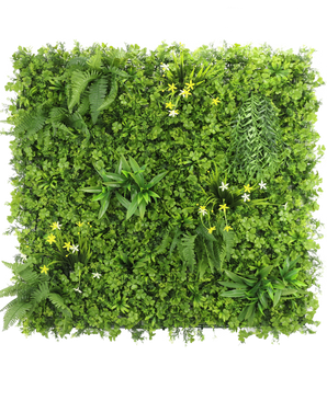 The Artificial Hedge Daffodil Smile 100x100 cm UV is a square vertical green wall with dense green foliage, ferns and small yellow and white flowers, against a white background seen from above.
