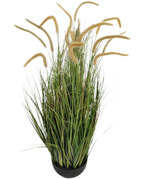The Artificial Grass Dogtail onion grass branch 110cm fire retardant is a potted artificial grass plant with long, narrow green leaves and tall, fluffy beige seed heads, depicted against a plain white background.