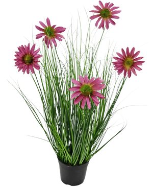 The Artificial Grass Plant Chrysanthemum 60 cm fire retardant has long, thin green grass-like leaves and six pink chrysanthemum flowers with a yellow heart in a black pot, against a plain white background.