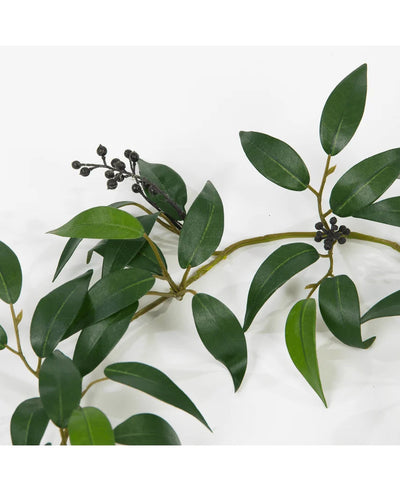 An Artificial Smilax Garland of 180 cm with long, narrow green leaves and small bunches of dark, round berries, depicted against a white background.