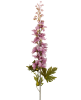 A single stem of Artificial Flower Delphinium 79 cm mauve with multiple mauve-toned pink and purple blossoms blooming upwards, accented by green leaves, pictured against a white background.