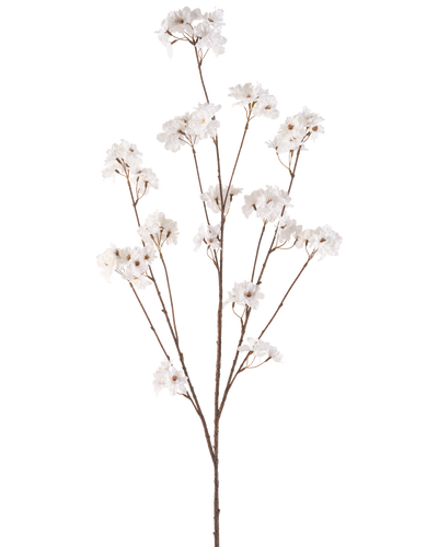 De Kunstbloem Kersenbloesem 130 cm crème heeft een enkele bruine steel die zich vertakt in meerdere dunne stelen, elk versierd met trosjes kleine, delicate crème kersenbloesem bloemen tegen een effen witte achtergrond.