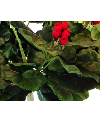 Close-up of lush green leaves with a cluster of vibrant red Artificial Geranium 40 cm axillary buds in between. The thick, slightly wavy leaves closely resemble high-quality artificial plants.