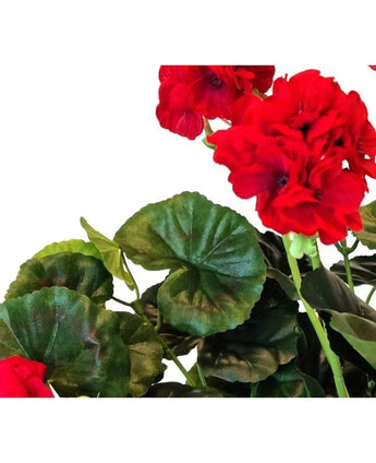 Close-up of an Artificial Geranium 40 cm red with vibrant red, ruffled petals and lush green, round leaves against a white background.