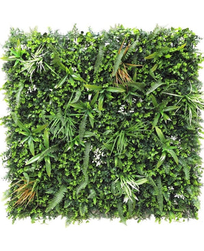 De Kunsthaag mat Savanne 100x100 cm is een vierkant groen wandpaneel dicht bedekt met UV-beschermde kunstvarens, grasachtige bladeren en kleine witte bloemen voor een weelderige, natuurlijke uitstraling in elke ruimte.