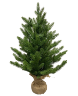 The Artificial Christmas Tree Mini "Munchi" 60 cm (100% PE) is a small, green pine with dense branches. Its base is wrapped in burlap and tied with twine and stands upright against a plain white background.