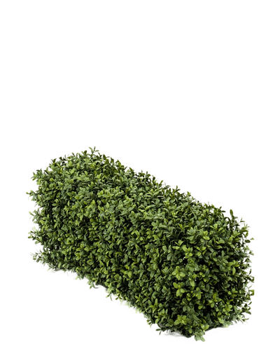 De Kunst Buxushaag UV 70x20x25 cm is een dichte, rechthoekige kunst buxusstruik met kleine groene blaadjes tegen een effen witte achtergrond.